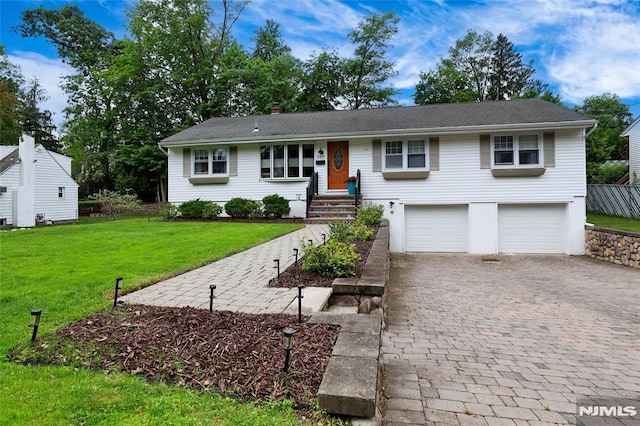 225 William St, River Vale, NJ 07675 - single story home with decorative driveway, a garage, a front lawn, and a chimney