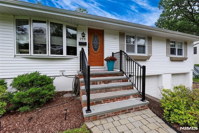 225 William St, River Vale, NJ 07675 - view of exterior entry featuring an attached garage