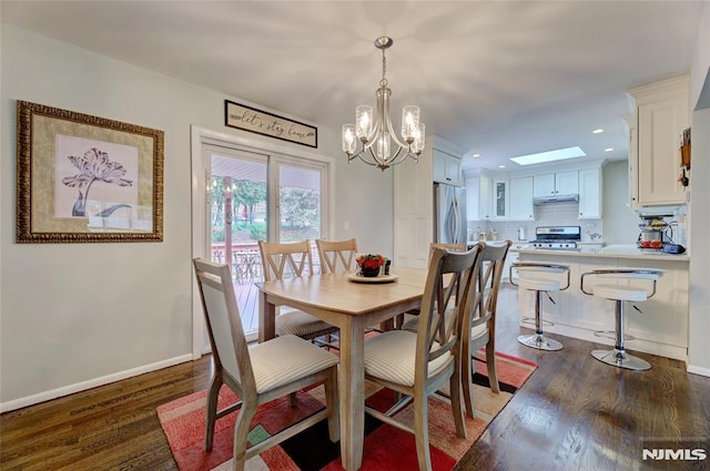 225 William St, River Vale, NJ 07675 - dining space featuring wood finished floors, a chandelier, recessed lighting, and baseboards