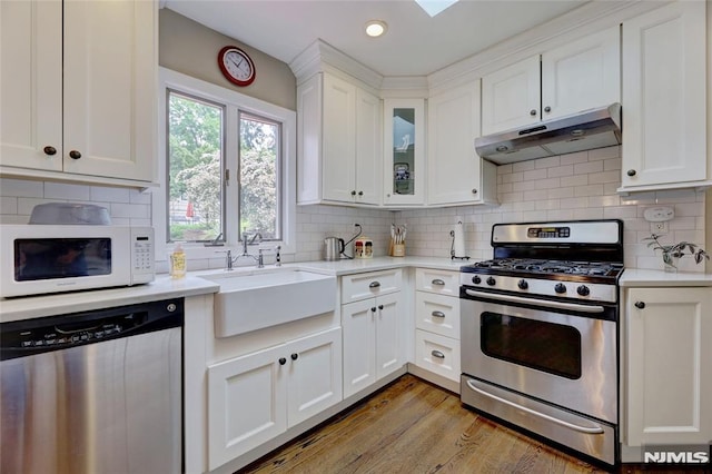 225 William St, River Vale, NJ 07675 - kitchen with stainless steel appliances, under cabinet range hood, light countertops, a sink, and recessed lighting