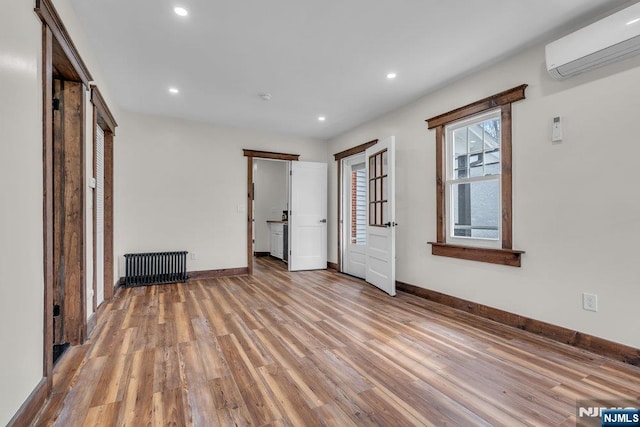 18 Edge Hill Rd, Blairstown, NJ 07825 - unfurnished bedroom with radiator heating unit, a wall unit AC, wood finished floors, recessed lighting, and baseboards