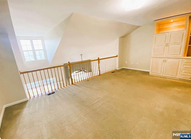 145 Riverwalk Way, Clifton, NJ 07014 - additional living space with carpet, vaulted ceiling, and baseboards