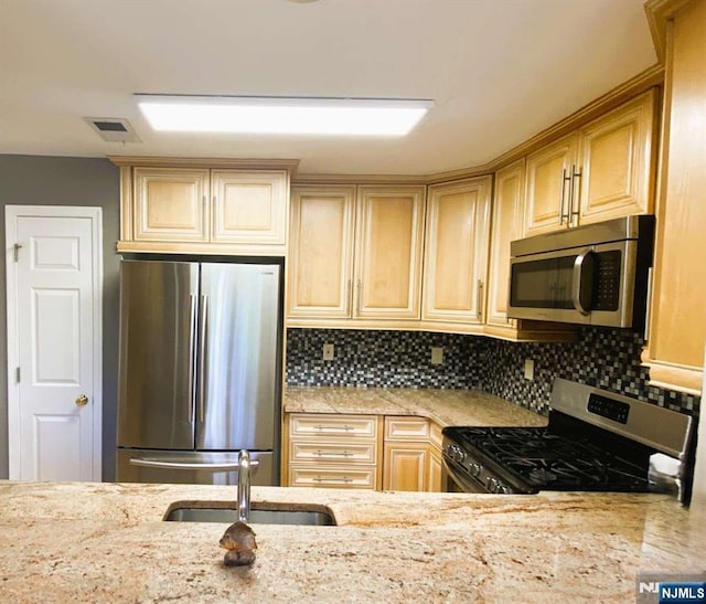 145 Riverwalk Way, Clifton, NJ 07014 - kitchen featuring stainless steel appliances, a sink, light stone counters, and decorative backsplash