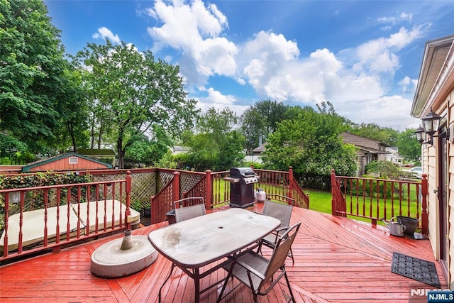 60 Lyon Rd, Waldwick, NJ 07463 - wooden terrace featuring grilling area and outdoor dining area