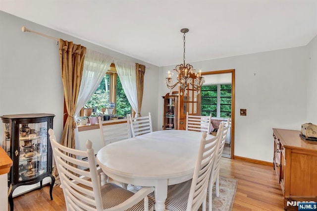 42 Cecilia Dr, Wayne, NJ 07470 - dining space featuring a chandelier, plenty of natural light, and light wood-type flooring