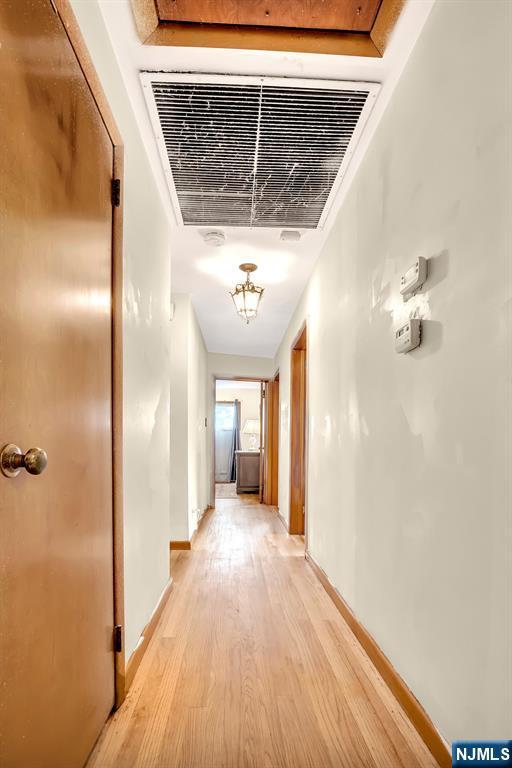 42 Cecilia Dr, Wayne, NJ 07470 - corridor with light wood-style floors and baseboards