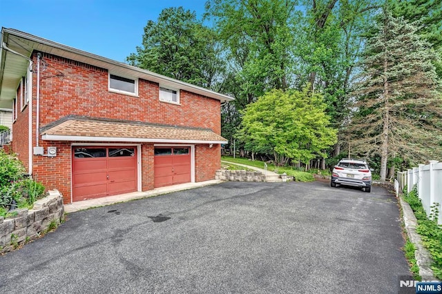 42 Cecilia Dr, Wayne, NJ 07470 - garage with asphalt driveway