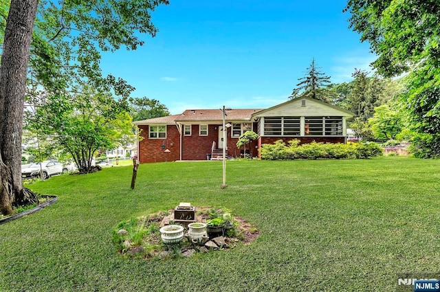 42 Cecilia Dr, Wayne, NJ 07470 - rear view of property featuring a yard, entry steps, and brick siding