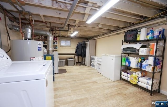 516 Beardsley Ave, Bloomfield, NJ 07003 - unfinished basement with gas water heater, washing machine and clothes dryer, wood finished floors, and refrigerator