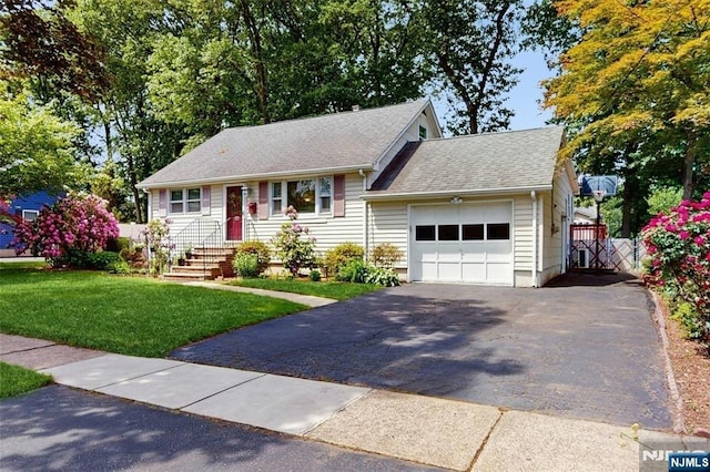 336 Ridgewood Blvd, Twp Of Washington, NJ 07676 - view of front facade featuring a garage, driveway, roof with shingles, and a gate
