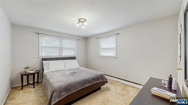336 Ridgewood Blvd, Twp Of Washington, NJ 07676 - bedroom with a baseboard heating unit, light carpet, and baseboards