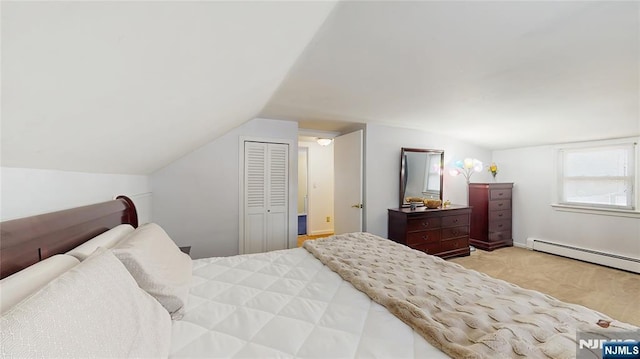 336 Ridgewood Blvd, Twp Of Washington, NJ 07676 - carpeted bedroom featuring a baseboard heating unit, lofted ceiling, and a closet