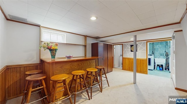 336 Ridgewood Blvd, Twp Of Washington, NJ 07676 - indoor dry bar with washer / dryer, ornamental molding, wainscoting, wooden walls, and light carpet