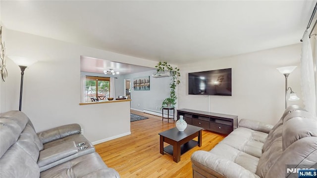 336 Ridgewood Blvd, Twp Of Washington, NJ 07676 - living room featuring wood finished floors, baseboards, baseboard heating, and a chandelier