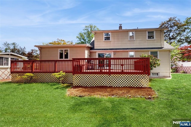 336 Ridgewood Blvd, Twp Of Washington, NJ 07676 - back of property with a wooden deck, a lawn, and a chimney