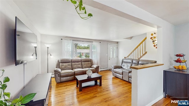 336 Ridgewood Blvd, Twp Of Washington, NJ 07676 - living room featuring light wood finished floors, a baseboard radiator, and stairway