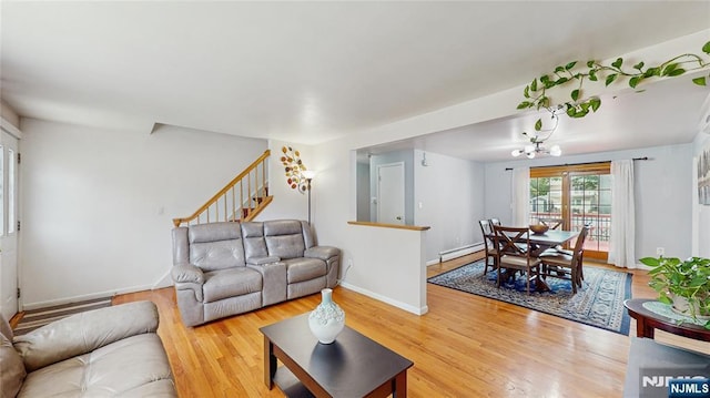 336 Ridgewood Blvd, Twp Of Washington, NJ 07676 - living area featuring light wood-style floors, a chandelier, and baseboards
