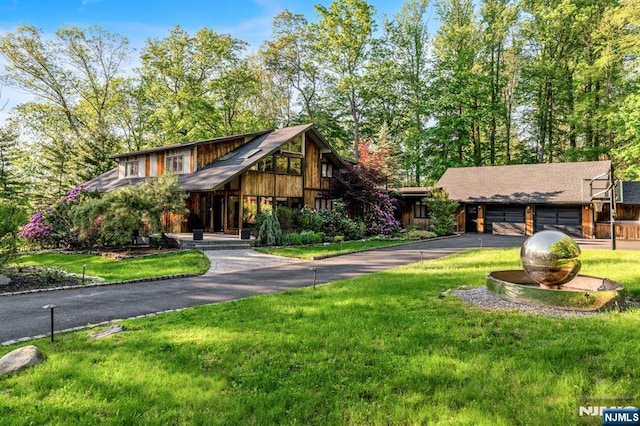 18 Lomas Ln, Montvale, NJ 07645 - view of front facade with a front yard and asphalt driveway