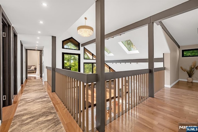 18 Lomas Ln, Montvale, NJ 07645 - corridor with a skylight, light wood-style floors, vaulted ceiling, baseboards, and recessed lighting
