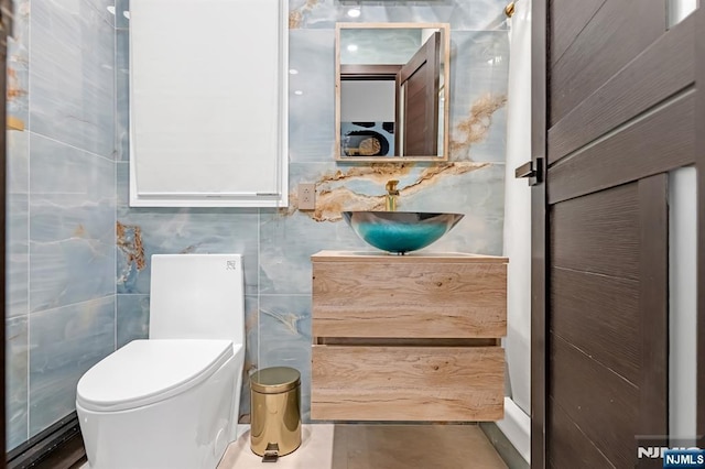 18 Lomas Ln, Montvale, NJ 07645 - half bath featuring vanity, toilet, and tile walls
