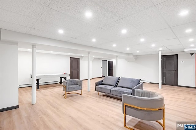 18 Lomas Ln, Montvale, NJ 07645 - living area with a baseboard heating unit, light wood-style floors, baseboard heating, baseboards, and recessed lighting