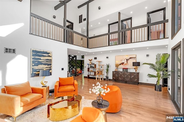 18 Lomas Ln, Montvale, NJ 07645 - living area featuring a high ceiling, wood finished floors, and baseboards