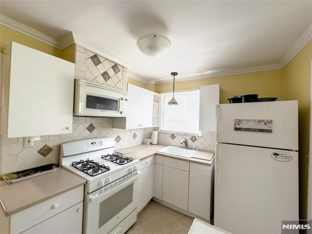 51 Minnehaha Blvd, Par-Troy Hills Twp, NJ 07034 - kitchen with white appliances, a sink, light countertops, decorative backsplash, and ornamental molding