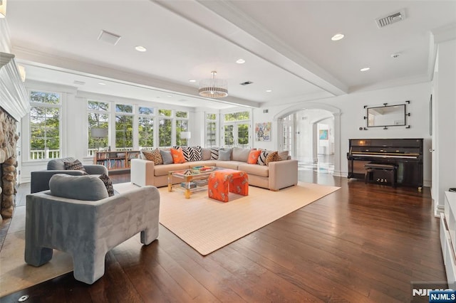 1021 Hillcrest Rd, Ridgewood, NJ 07450 - living room featuring arched walkways, dark wood-type flooring, recessed lighting, ornamental molding, and beam ceiling