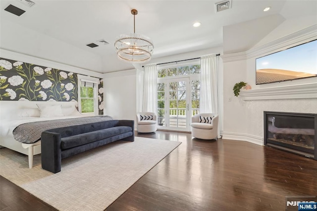 1021 Hillcrest Rd, Ridgewood, NJ 07450 - bedroom featuring wood finished floors, access to exterior, a chandelier, recessed lighting, and a fireplace