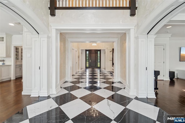 1021 Hillcrest Rd, Ridgewood, NJ 07450 - corridor with arched walkways, baseboards, and ornate columns