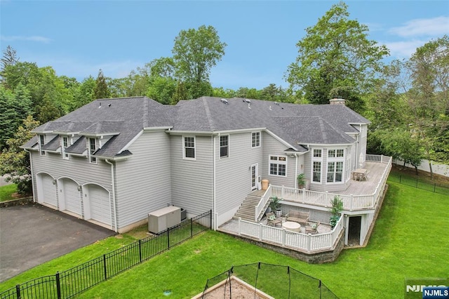 1021 Hillcrest Rd, Ridgewood, NJ 07450 - rear view of property with a deck, a shingled roof, driveway, and a chimney