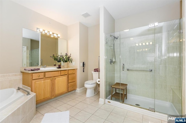 308 Holly Ln Unit 32, Cedar Grove, NJ 07009 - bathroom featuring vanity, a shower stall, toilet, tile patterned flooring, and a garden tub