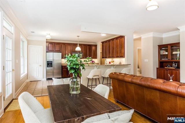 308 Holly Ln Unit 32, Cedar Grove, NJ 07009 - dining area with ornamental molding and light wood-style floors