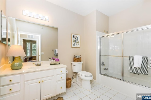 308 Holly Ln Unit 32, Cedar Grove, NJ 07009 - full bathroom with toilet, vanity, tile patterned floors, and enclosed tub / shower combo