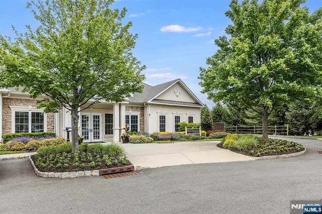 308 Holly Ln Unit 32, Cedar Grove, NJ 07009 - view of front of house featuring french doors, stone siding, and stucco siding
