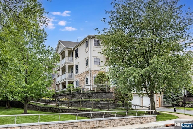 308 Holly Ln Unit 32, Cedar Grove, NJ 07009 - view of property with an attached garage and concrete driveway