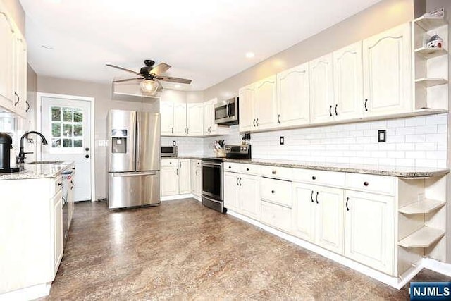 2 Hartland Ave, Emerson, NJ 07630 - kitchen featuring appliances with stainless steel finishes, open shelves, a sink, a ceiling fan, and tasteful backsplash