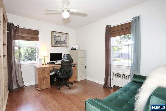 2 Hartland Ave, Emerson, NJ 07630 - home office with radiator heating unit, dark wood-style floors, a ceiling fan, and baseboards