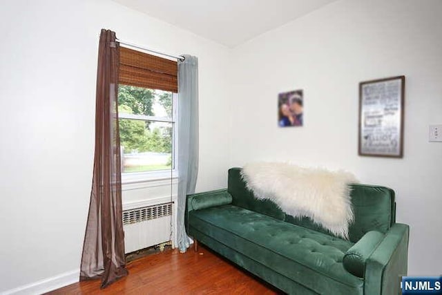 2 Hartland Ave, Emerson, NJ 07630 - living area with radiator heating unit, wood finished floors, and baseboards