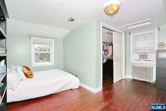 2 Hartland Ave, Emerson, NJ 07630 - bedroom with radiator, baseboards, wood finished floors, vaulted ceiling, and a closet