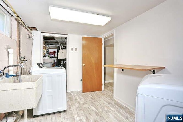2 Hartland Ave, Emerson, NJ 07630 - laundry area featuring independent washer and dryer, light wood-type flooring, and baseboards