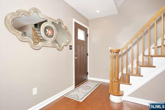 2 Hartland Ave, Emerson, NJ 07630 - entrance foyer with wood finished floors, stairs, and baseboards
