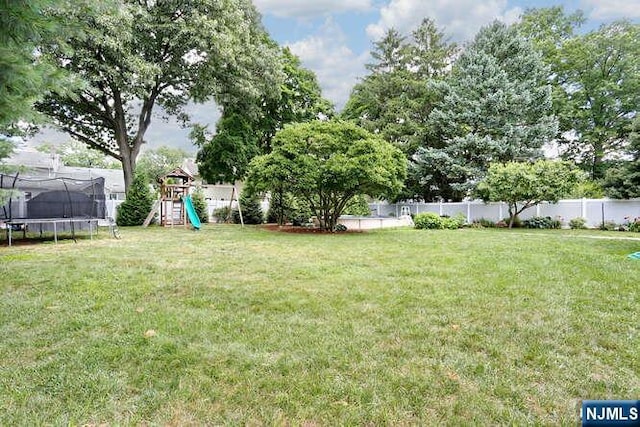 2 Hartland Ave, Emerson, NJ 07630 - view of yard featuring a trampoline and a playground