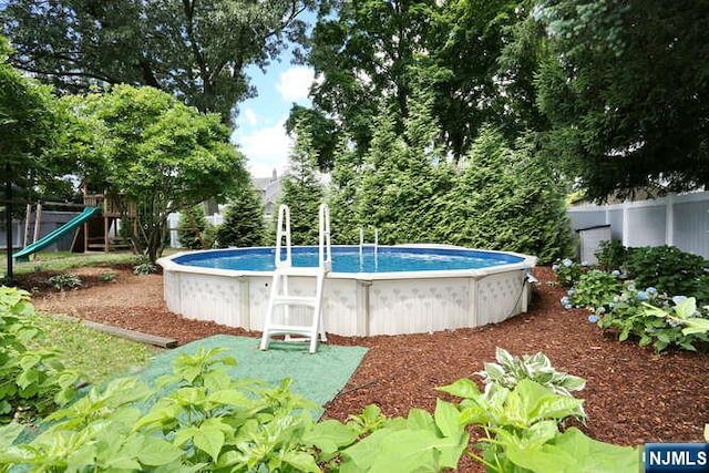 2 Hartland Ave, Emerson, NJ 07630 - view of swimming pool with a playground