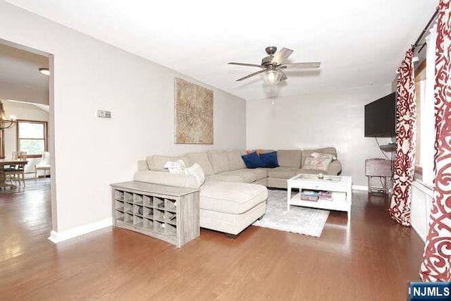 2 Hartland Ave, Emerson, NJ 07630 - living room with wood finished floors, ceiling fan, baseboards, and a chandelier