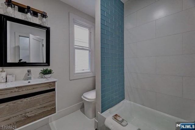46 Rutgers Pl, Passaic, NJ 07055 - full bathroom with vanity, toilet, shower / washtub combination, and baseboards