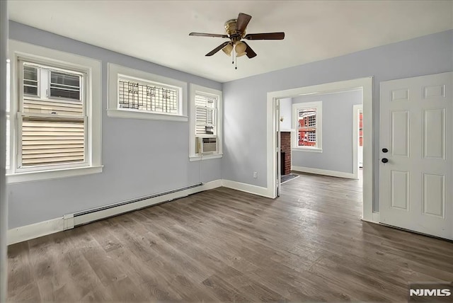 27 Berkeley Pl, Bloomfield, NJ 07003 - spare room with a baseboard heating unit, a ceiling fan, baseboards, and healthy amount of natural light