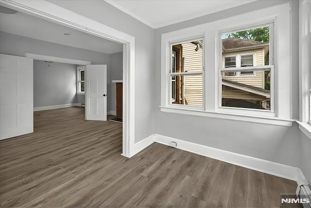 27 Berkeley Pl, Bloomfield, NJ 07003 - unfurnished room with baseboards, dark wood-type flooring, and ornamental molding