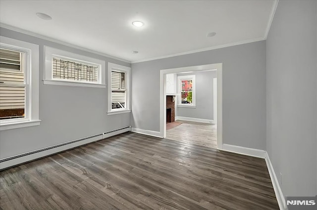 27 Berkeley Pl, Bloomfield, NJ 07003 - unfurnished room with ornamental molding, baseboards, wood finished floors, a fireplace, and a baseboard radiator