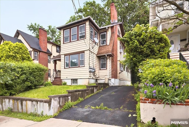 27 Berkeley Pl, Bloomfield, NJ 07003 - view of front of home with a chimney